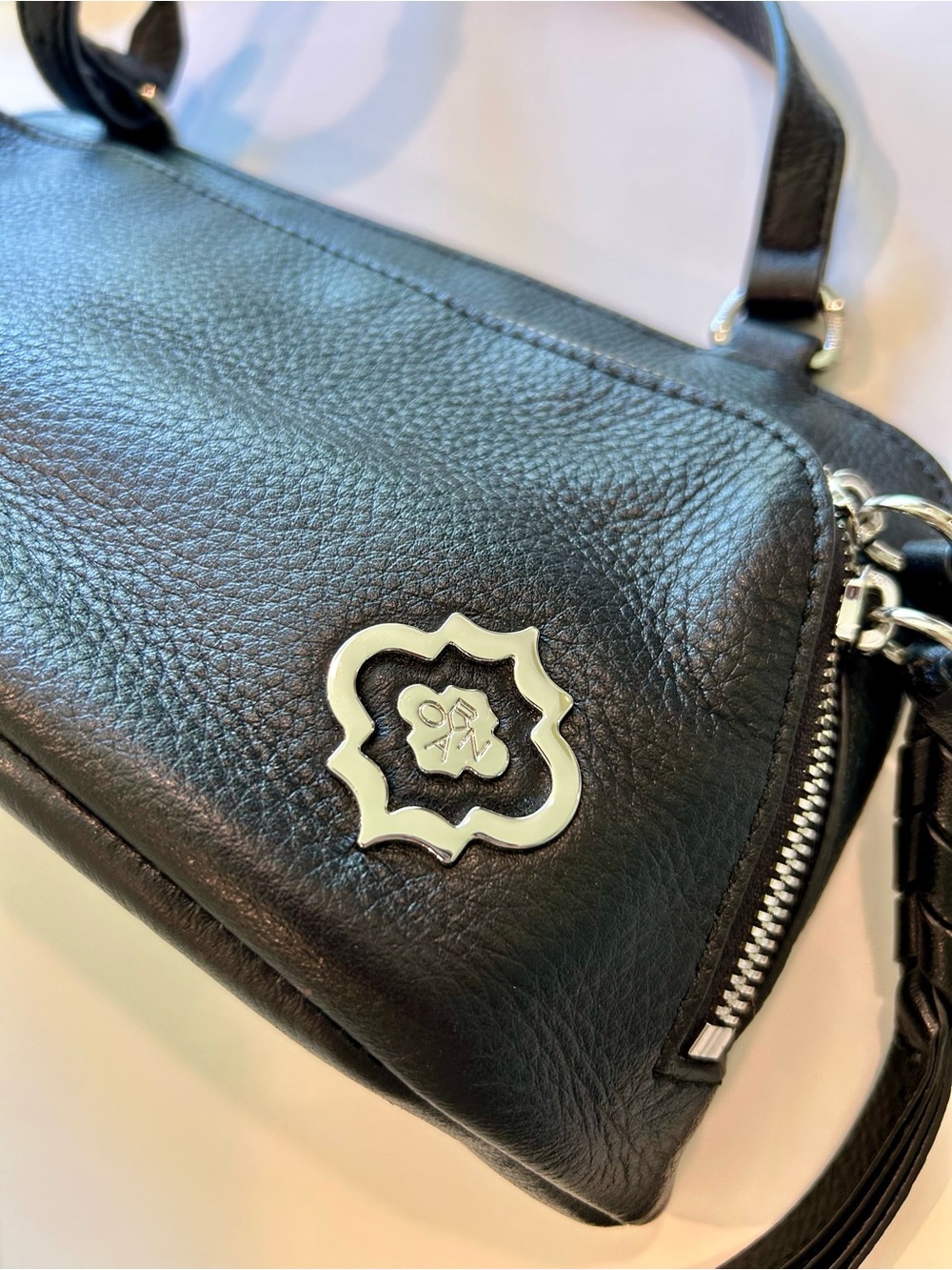orYANY Black Leather Crossbody with Silver Emblem
